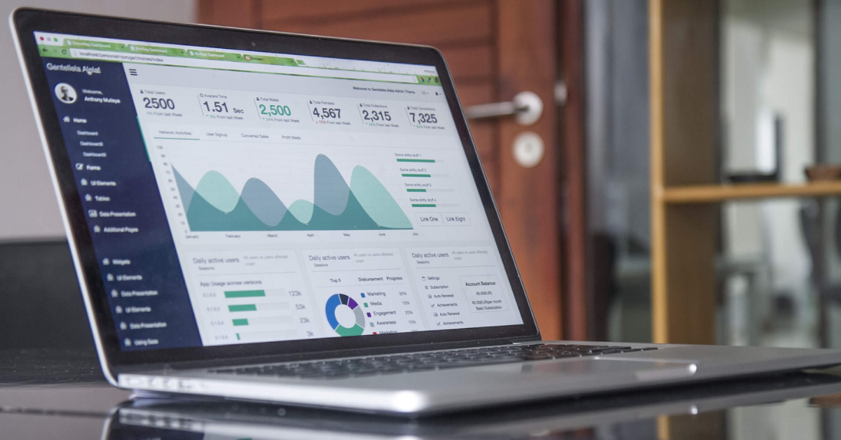 Graphs and data is seen on a laptop screen.