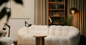 A couch with microphones set up for a podcast